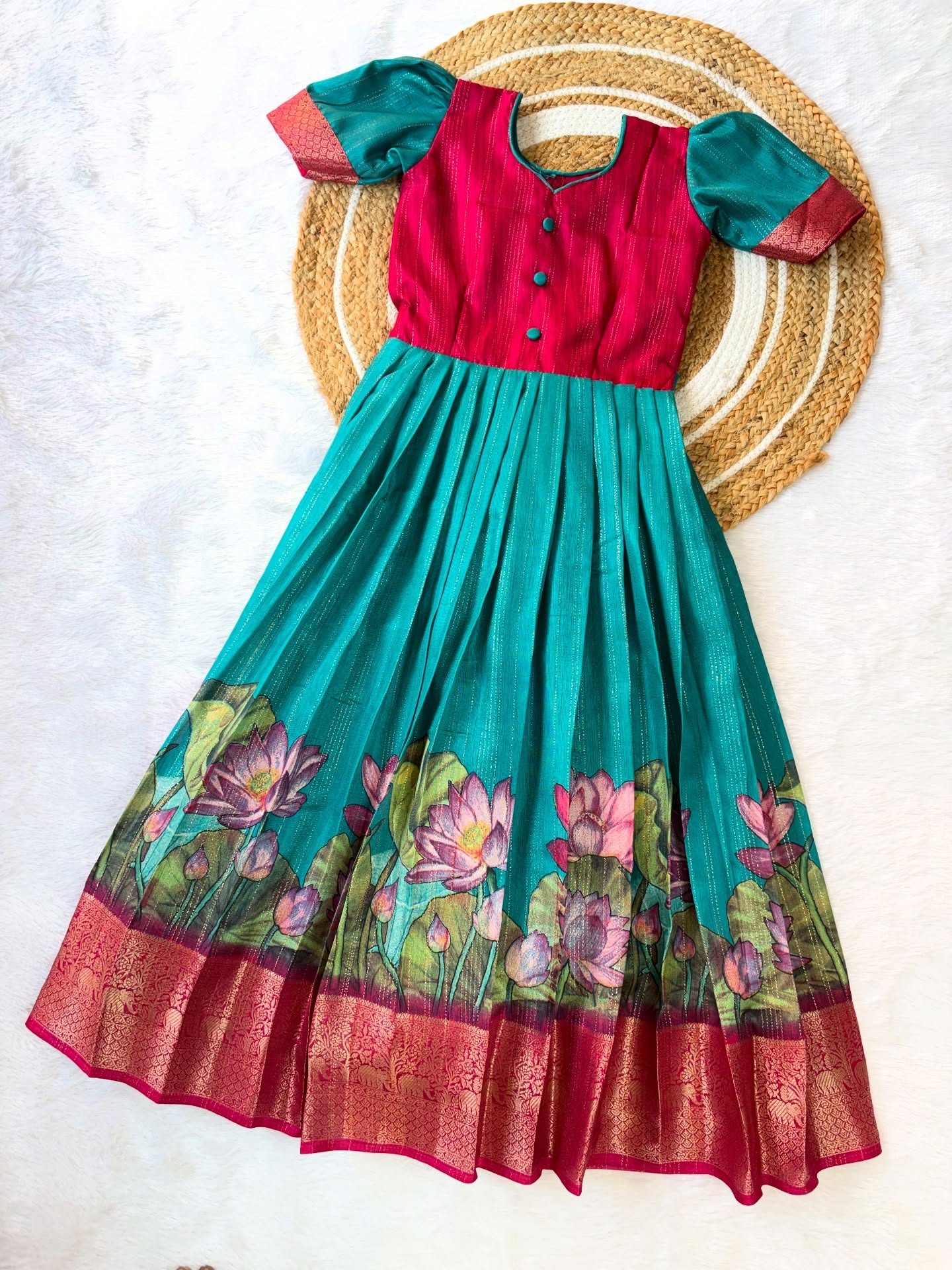 Elegant silk frock in a beautiful colour combination, adorned with a delicate lotus motif