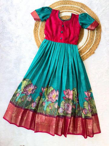 Elegant silk frock in a beautiful colour combination, adorned with a delicate lotus motif