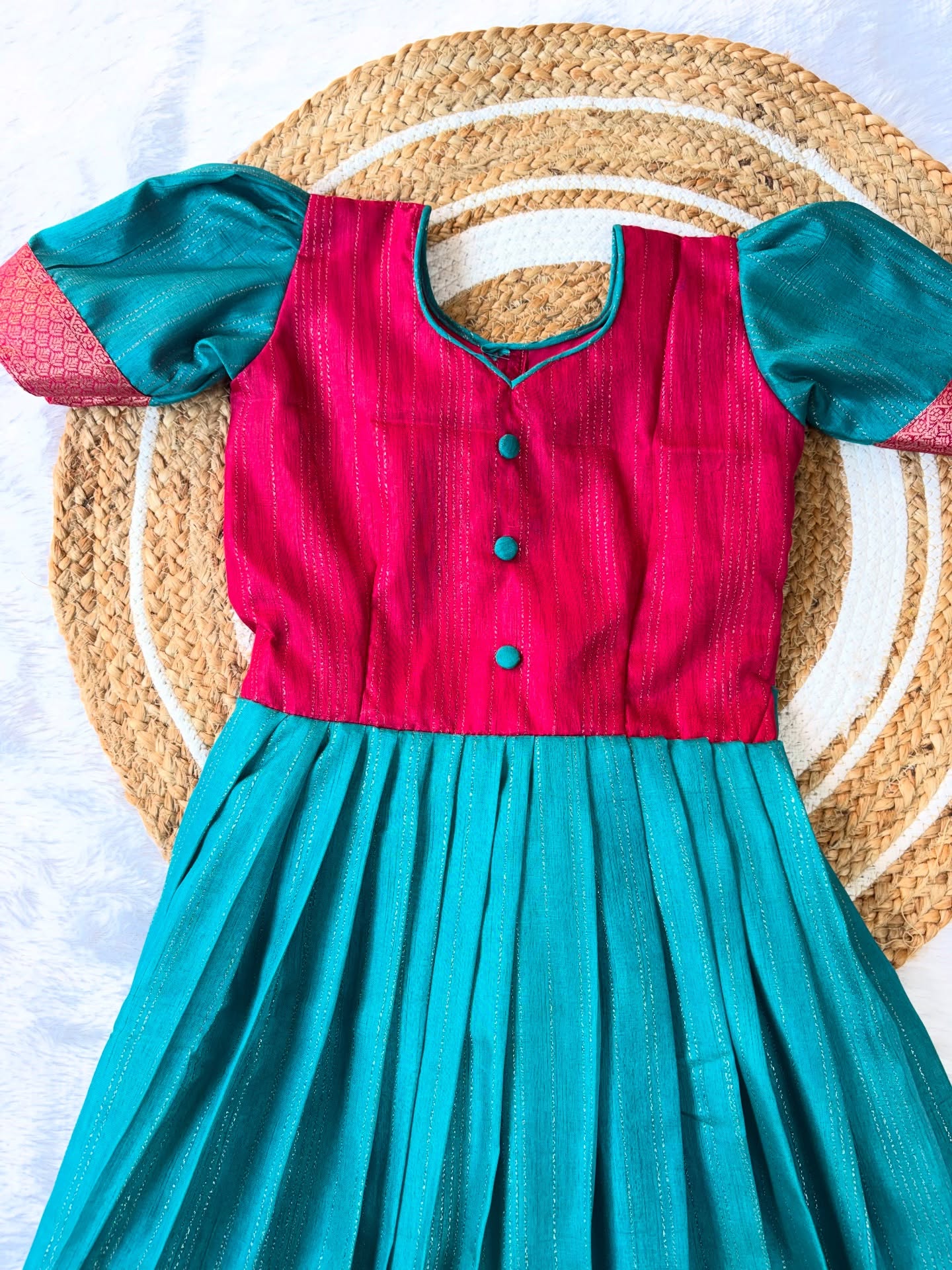 Elegant silk frock in a beautiful colour combination, adorned with a delicate lotus motif