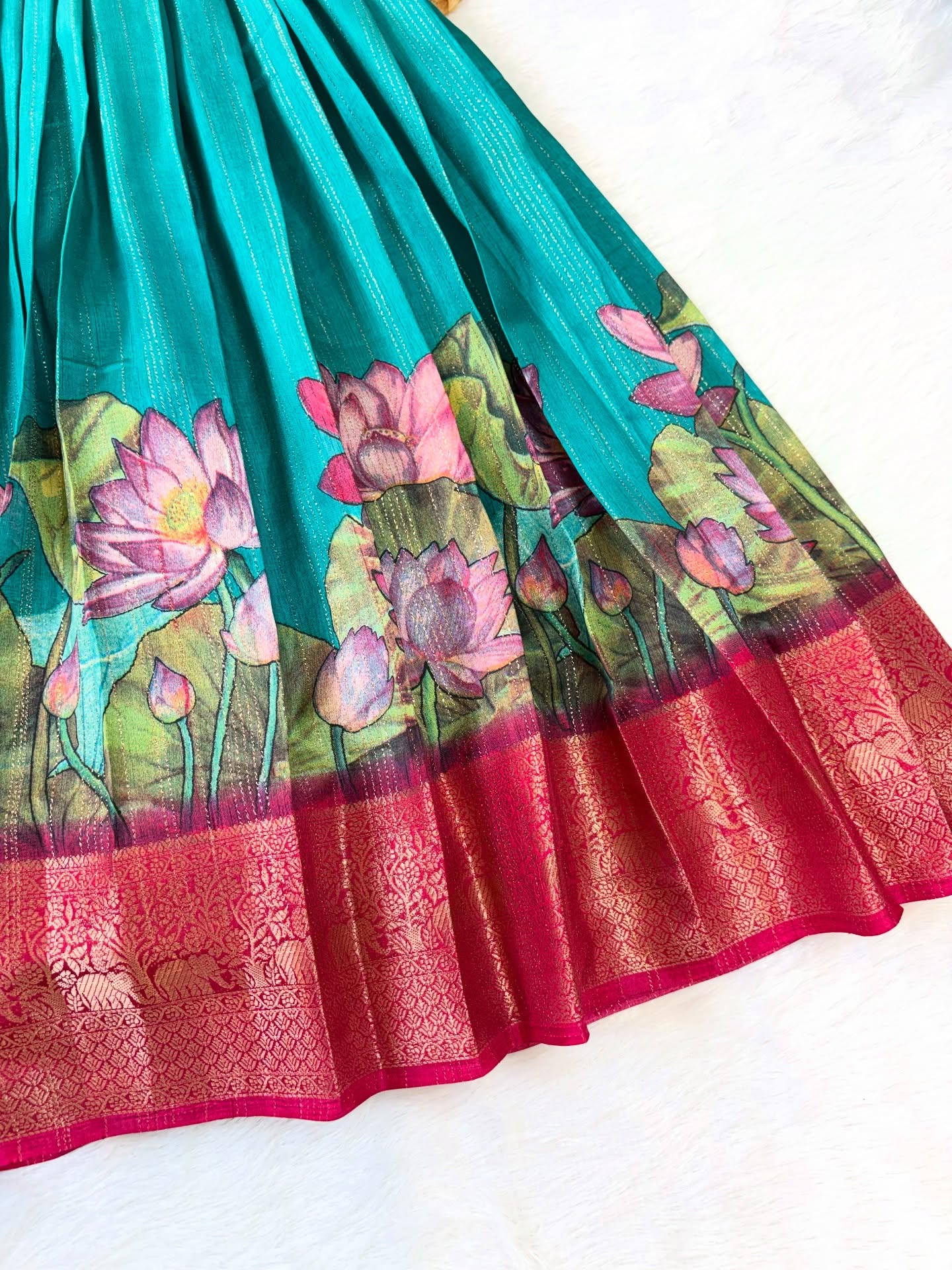 Elegant silk frock in a beautiful colour combination, adorned with a delicate lotus motif
