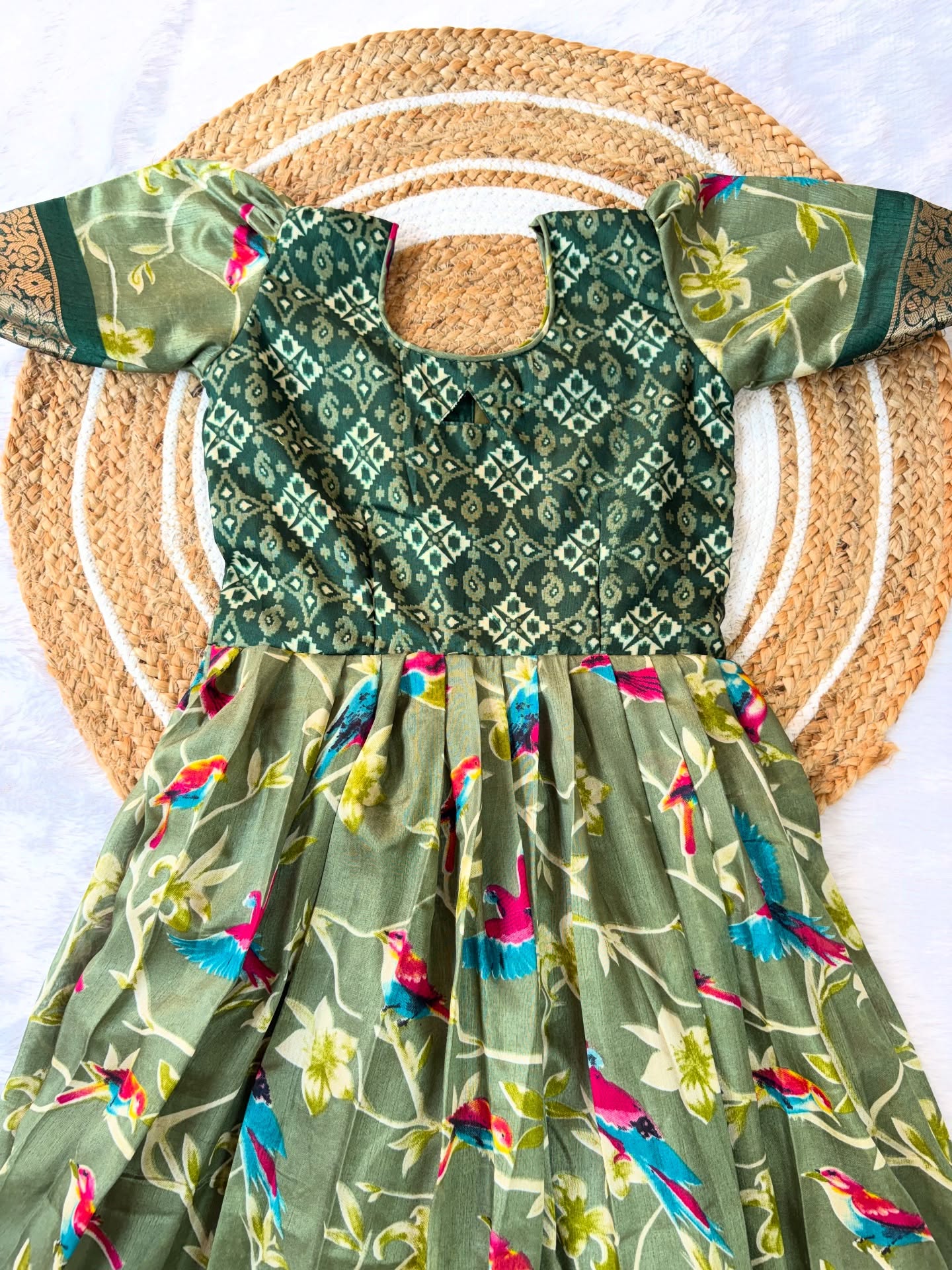 Stunning olive green long frock featuring a delicate bird design