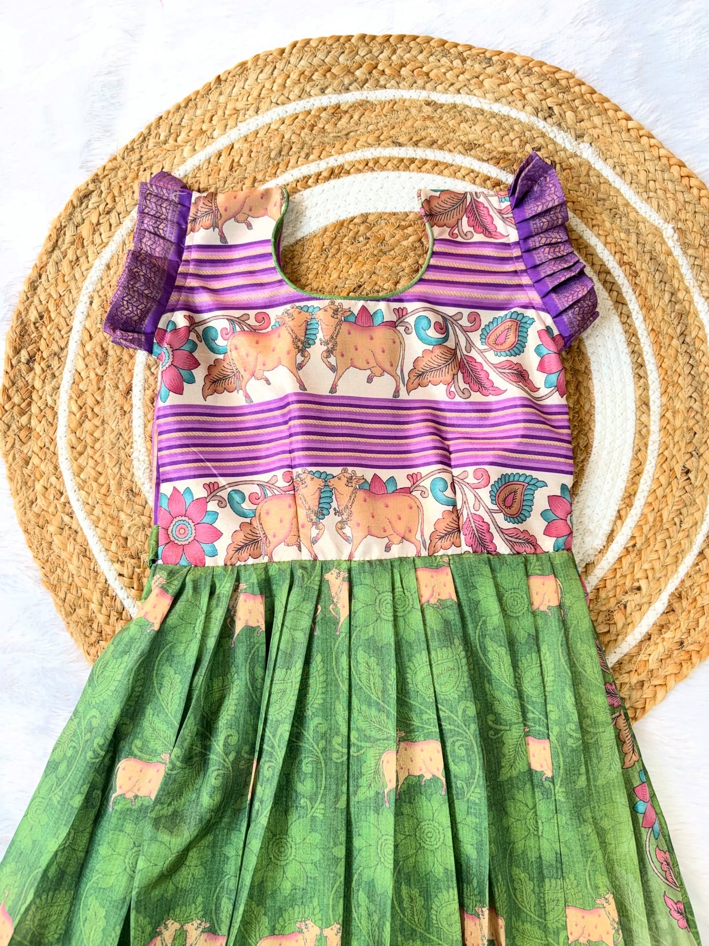 Kids long frock in a graceful olive green shade, paired with a vibrant violet border