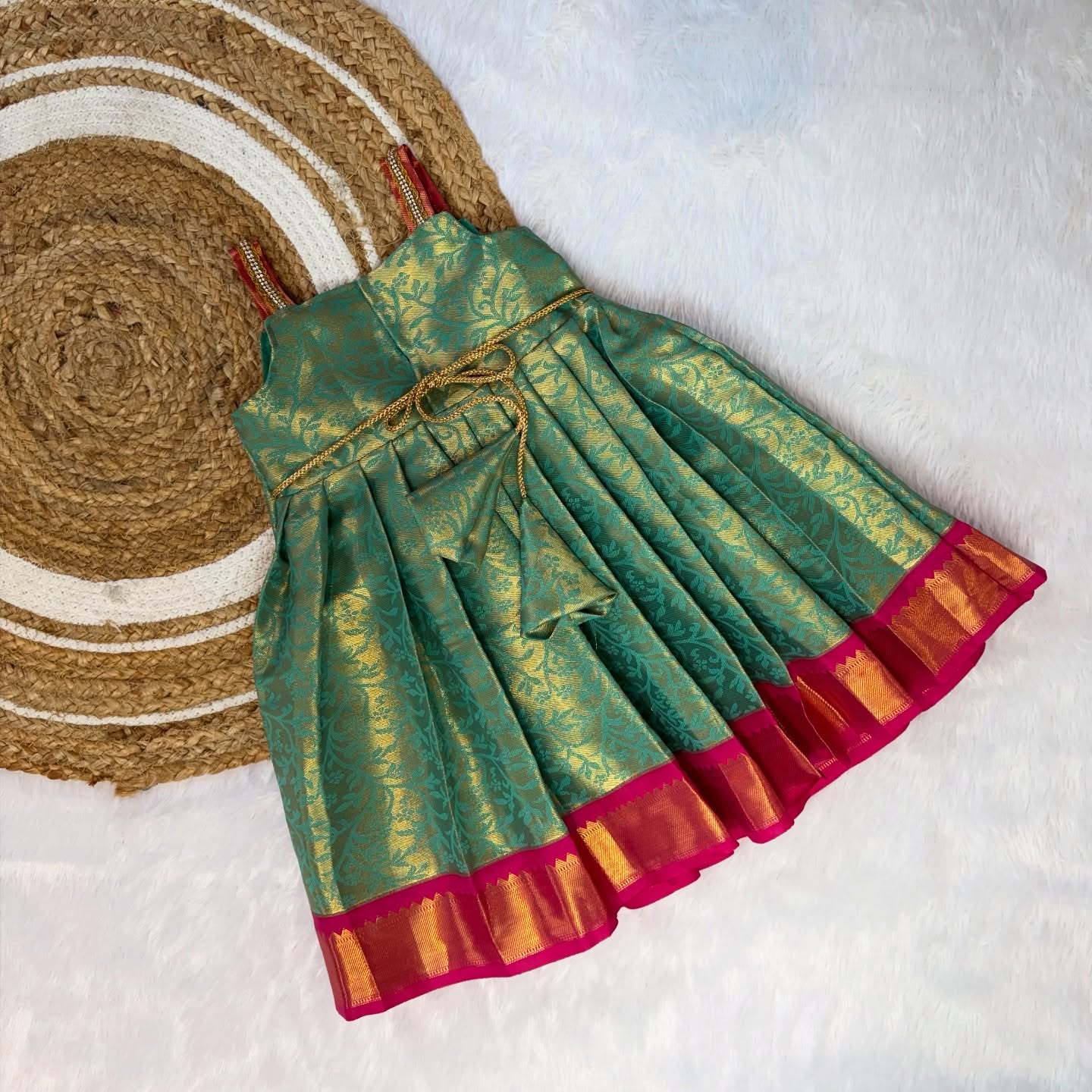 Celebrate this festive season with our Premium Green with Pink Kanchipattu Frock