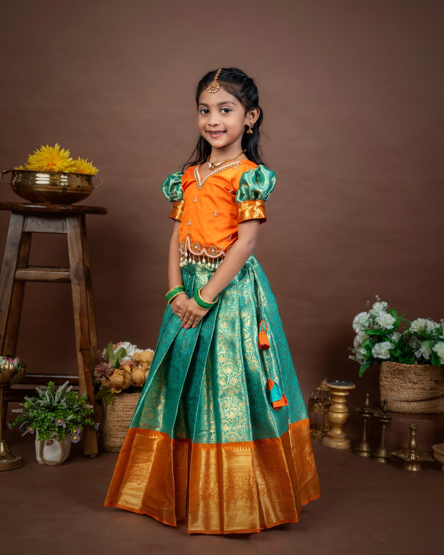 VASUNDRA - Pastel green elegance with a vibrant orange border Premium Semi Kanchipattu