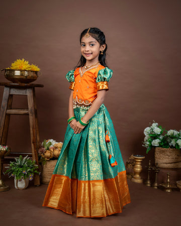 VASUNDRA - Pastel green elegance with a vibrant orange border Premium Semi Kanchipattu