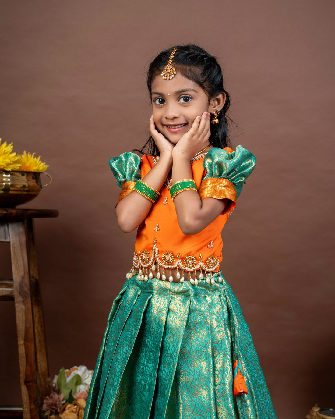 VASUNDRA - Pastel green elegance with a vibrant orange border Premium Semi Kanchipattu