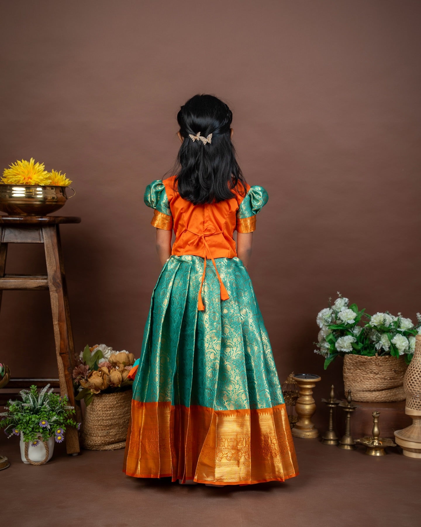 VASUNDRA - Pastel green elegance with a vibrant orange border Premium Semi Kanchipattu