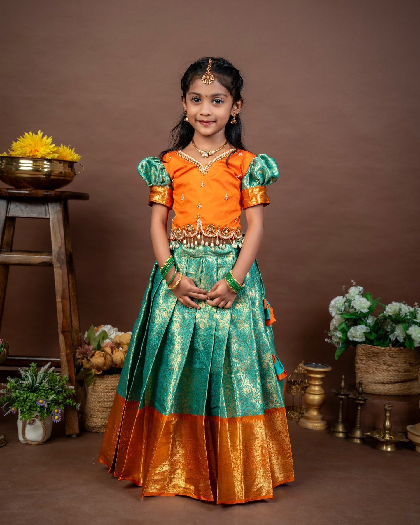 VASUNDRA - Pastel green elegance with a vibrant orange border Premium Semi Kanchipattu