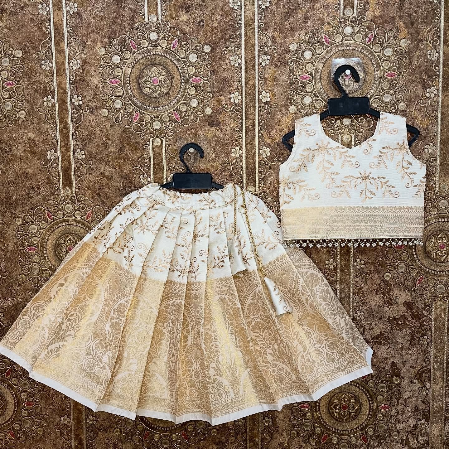Ivory-white base with premium Banarasi weaving and embroidery Paavadai Sattai