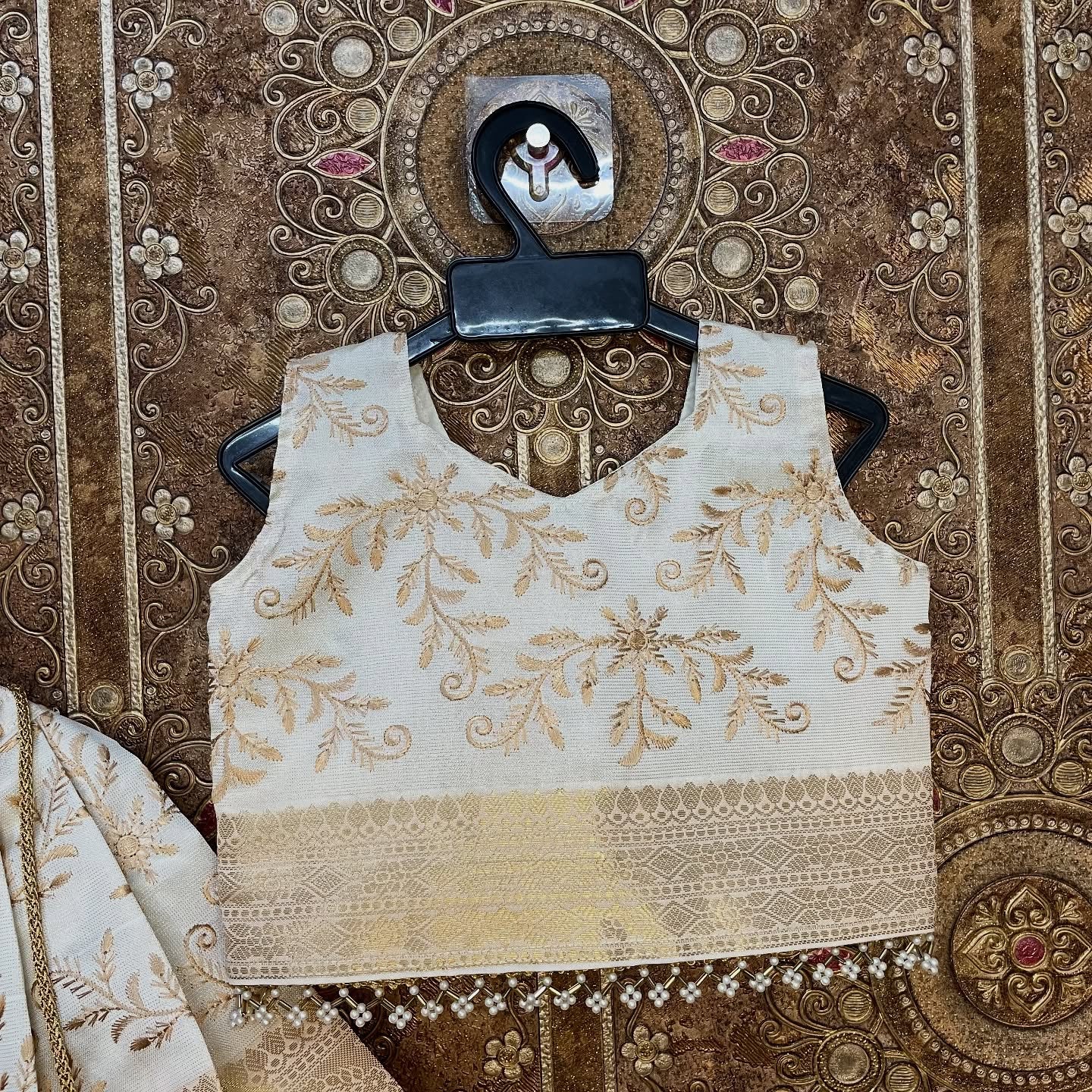 Ivory-white base with premium Banarasi weaving and embroidery Paavadai Sattai