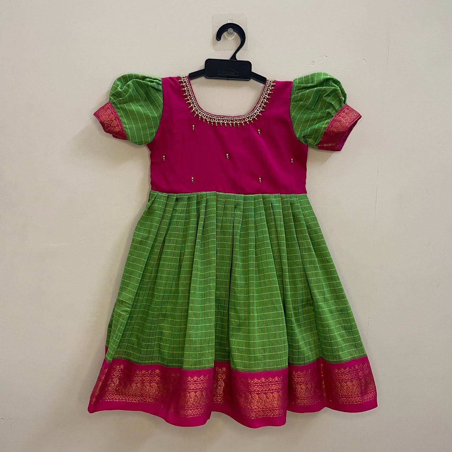 Pure comfort and elegance with our Handloom Kalyani Silk Frock, Green and Pink specially designed for delicate baby skin