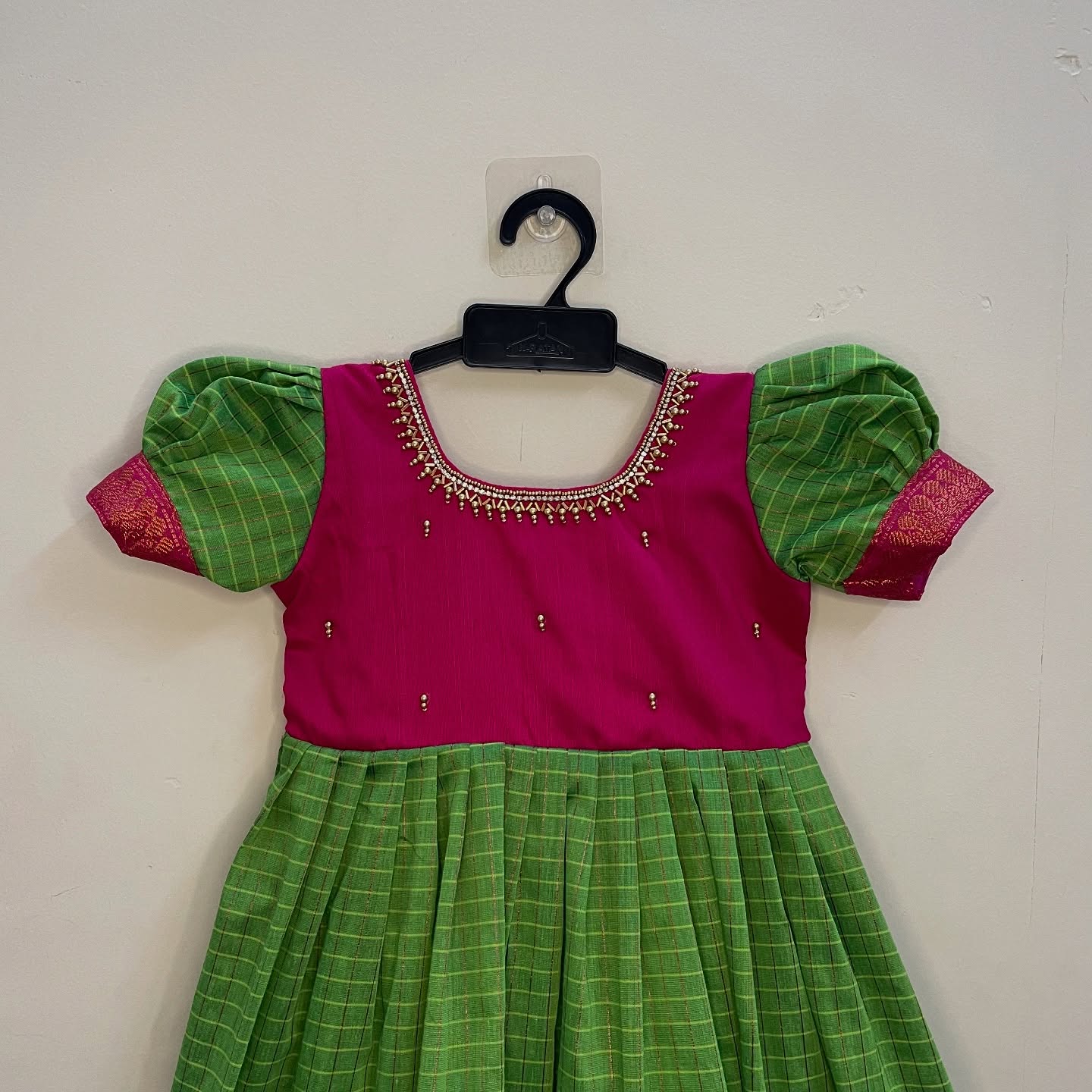 Pure comfort and elegance with our Handloom Kalyani Silk Frock, Green and Pink specially designed for delicate baby skin