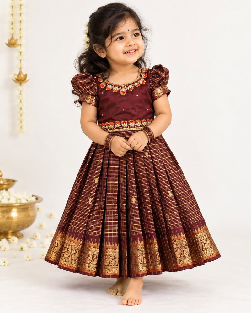 AATHIRAI - A rich maroon & gold traditional dress crafted for those beautiful festive moments