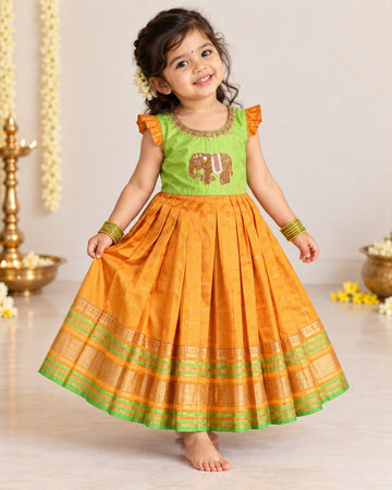 LAYA - A beautiful green & Mustard Yellow traditional long frock with an intricate elephant motif embellishment