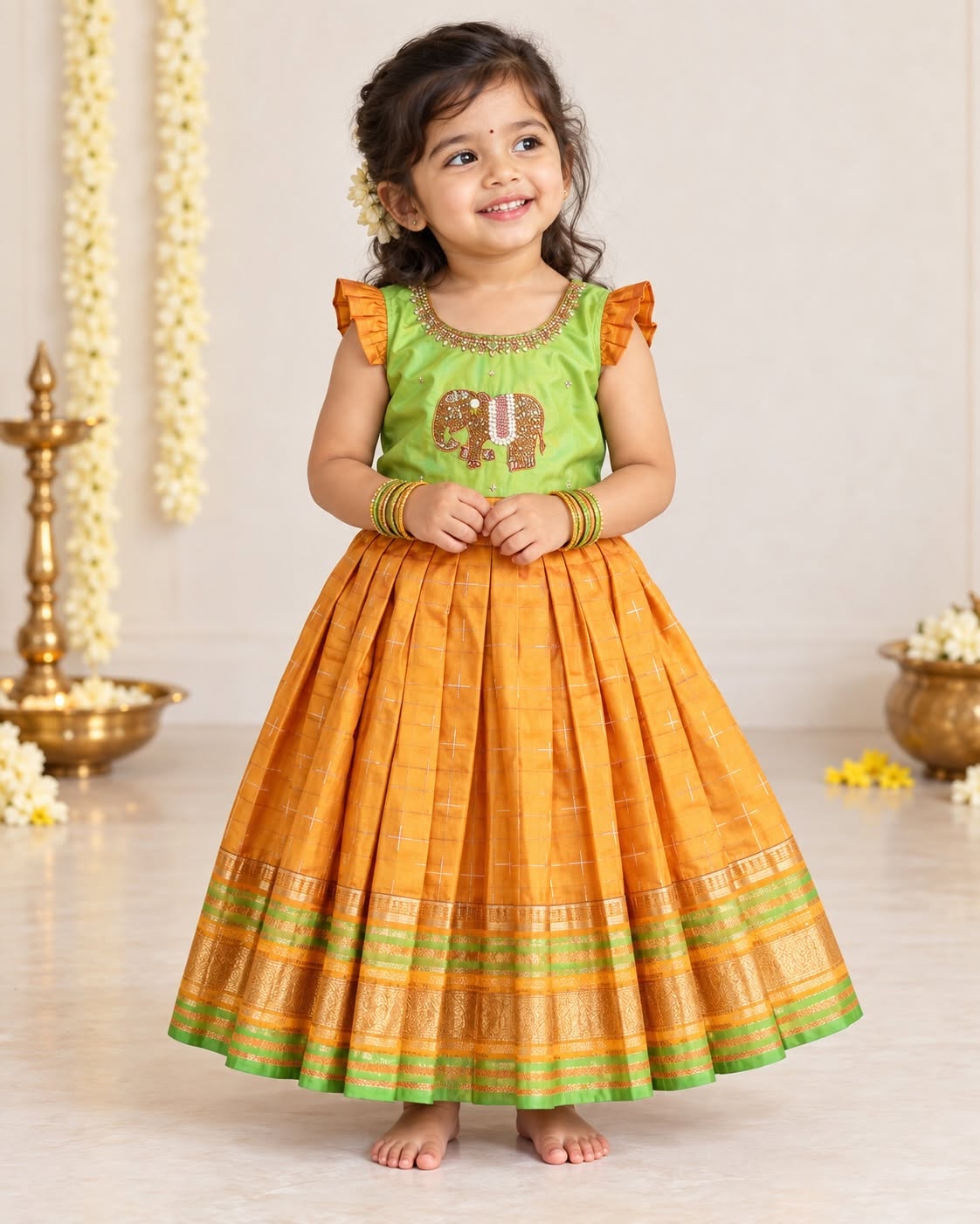 LAYA - A beautiful green & Mustard Yellow traditional long frock with an intricate elephant motif embellishment