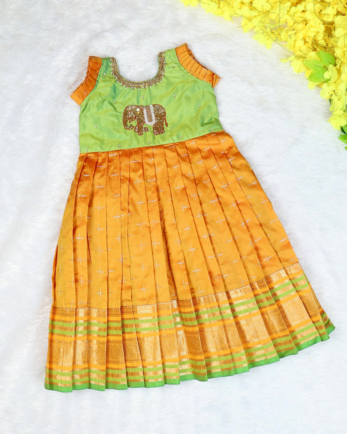 LAYA - A beautiful green & Mustard Yellow traditional long frock with an intricate elephant motif embellishment
