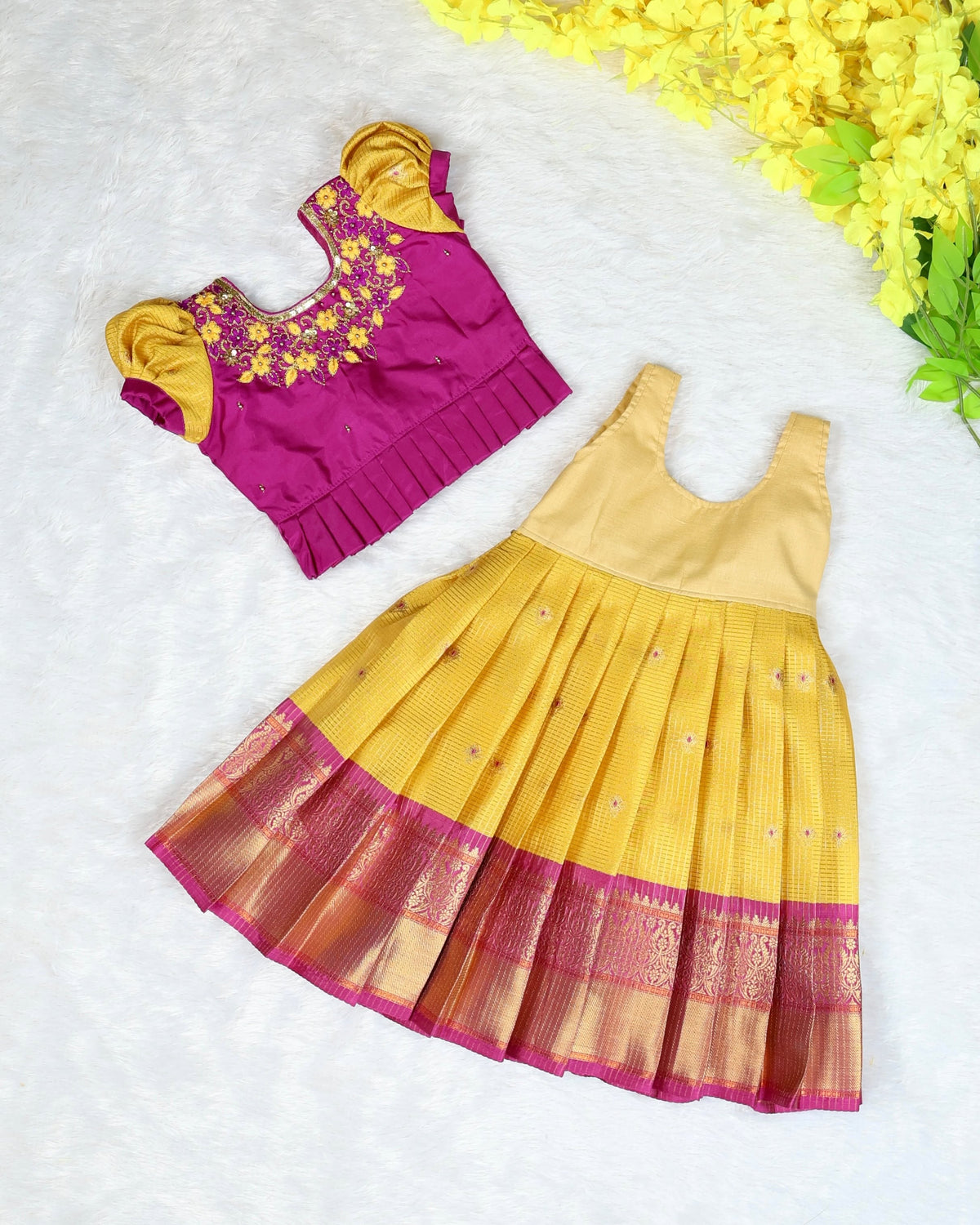 RADHAI - A gorgeous golden yellow & magenta festive set featuring a beautifully detailed Aari-work blouse
