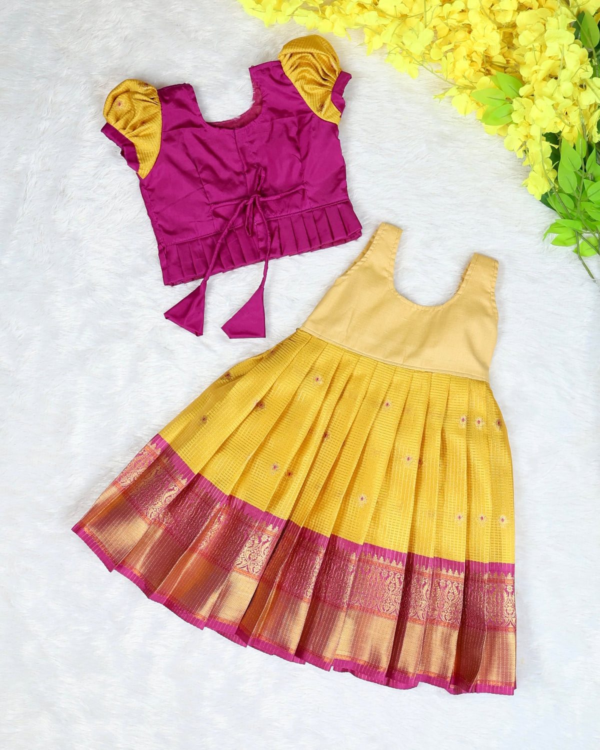 RADHAI - A gorgeous golden yellow & magenta festive set featuring a beautifully detailed Aari-work blouse
