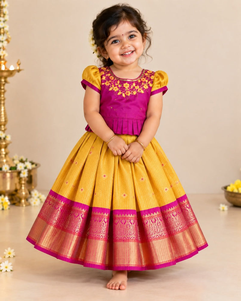 RADHAI - A gorgeous golden yellow & magenta festive set featuring a beautifully detailed Aari-work blouse