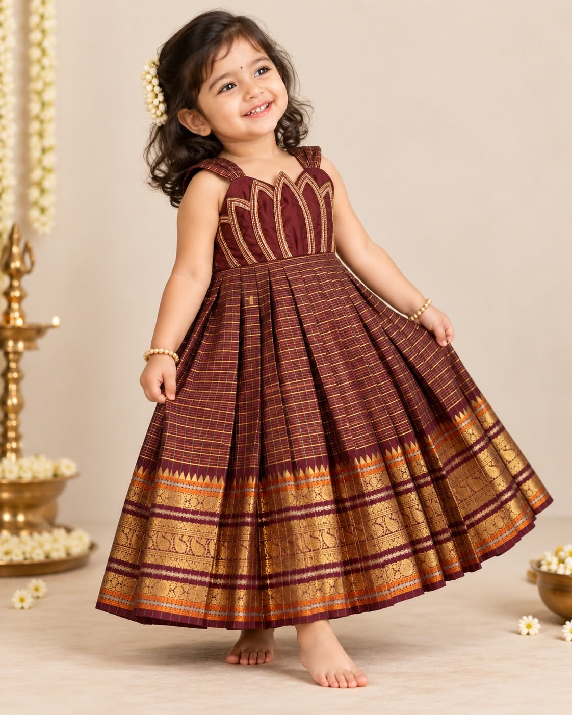 SENTHAMARAI - A rich deep brown frock beautifully adorned with intricate lotus Aariwork