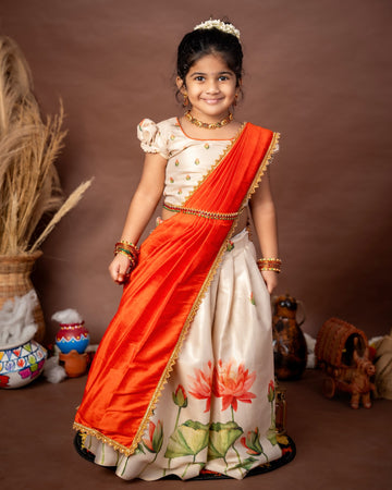 Ivory Skirt and Top floral motifs set with a contrast Orange color Thavani