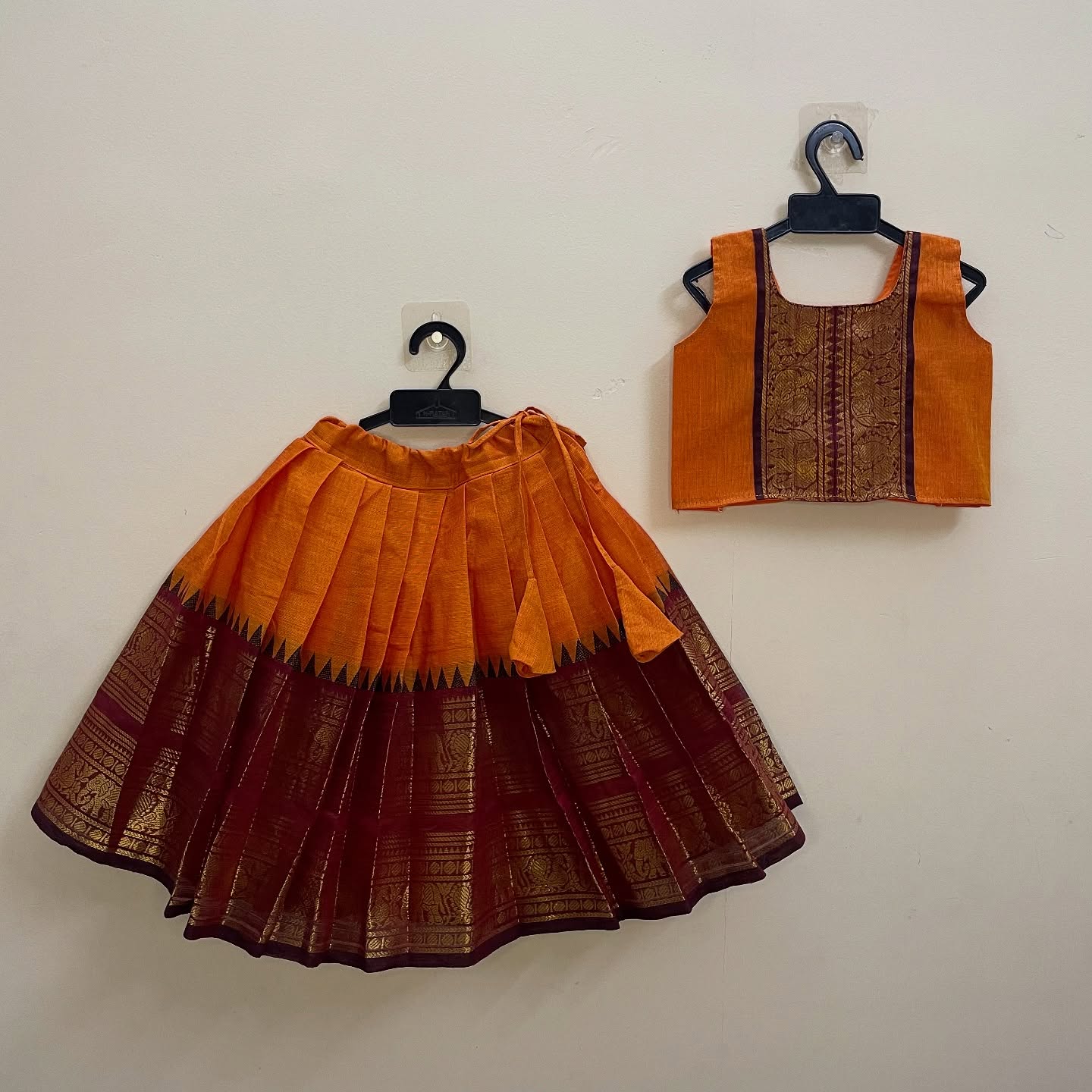 Narumugai Authentic Kanchi cotton Paavadai Sattai with traditional zari border – Orange and Maroon Color Combo