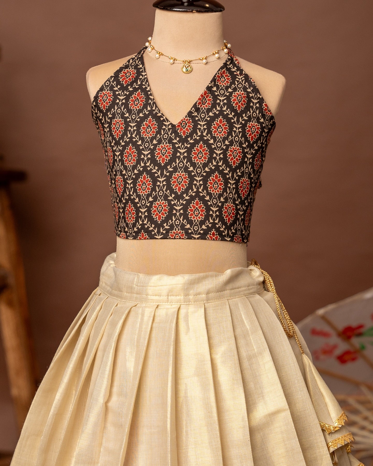 Black Ajrakh Halter Neck Top and Traditional Kathakali Motif Kasavu Skirt – Minmini Onam Collections