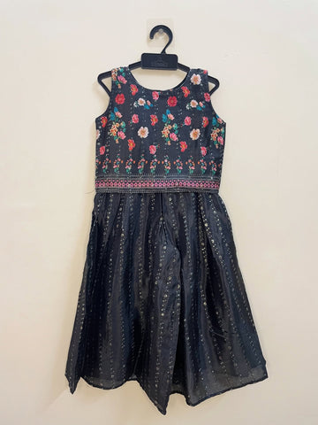 Effortlessly chic and stylish, this Black Palazzo Set with Shrug