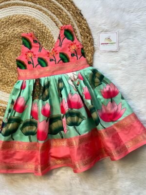 Most Demanding Pichwai Frock - Pastel Green & Orangish Peach Border  (Ready to Dispatch)