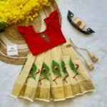 Red Aariwork Design Top with Kerala Cotton Peacock Feather Design Kasavu Skirt (Pre Booking) Onam Special