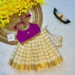 Vaadamalli Color Butter Silk Top with Kerala Cotton Checked Design Kasavu Skirt in Golden Zari - (Pre Booking) Onam Special