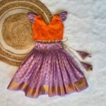 French Lilac Color Semi Kanchipattu Skirt & Mango Orange Color Raw Silk Top (Pre Booking)