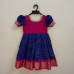 Pure comfort and elegance with our Handloom Kalyani Silk Frock, Red and Blue specially designed for delicate baby skin (Pre Booking)